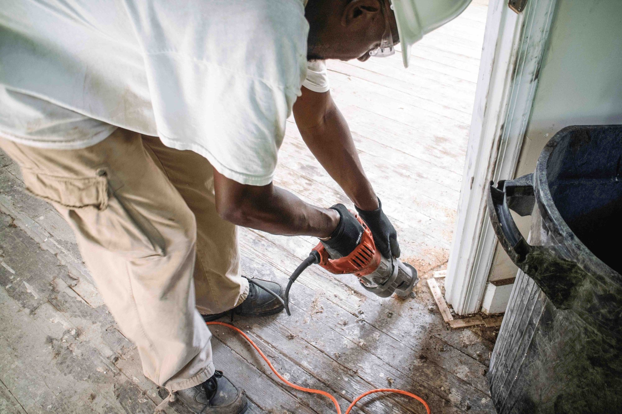 Person removing a wood floor